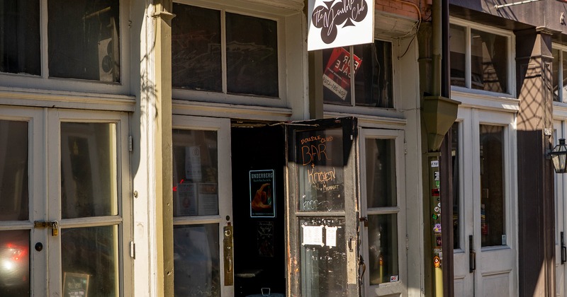Exterior, entrance to club, sign above