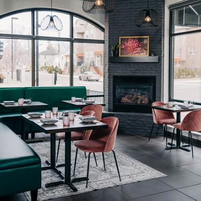 Pink Ivy Dining Room with Fireplace in the Kitchen.