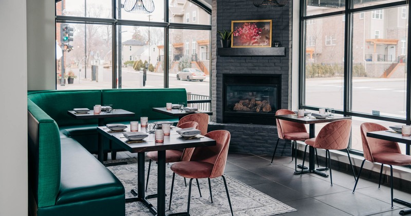 Interior, corner banquette seating with tables and chairs