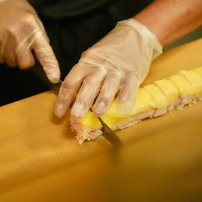Hands preparing food.