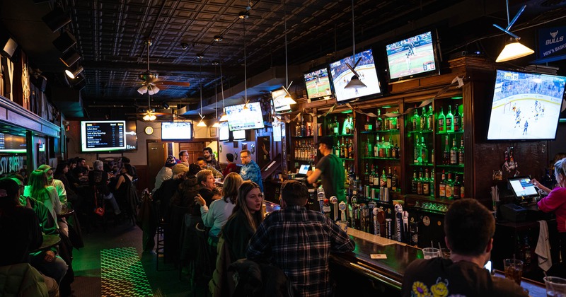 Interior, bar, guests and tv's above