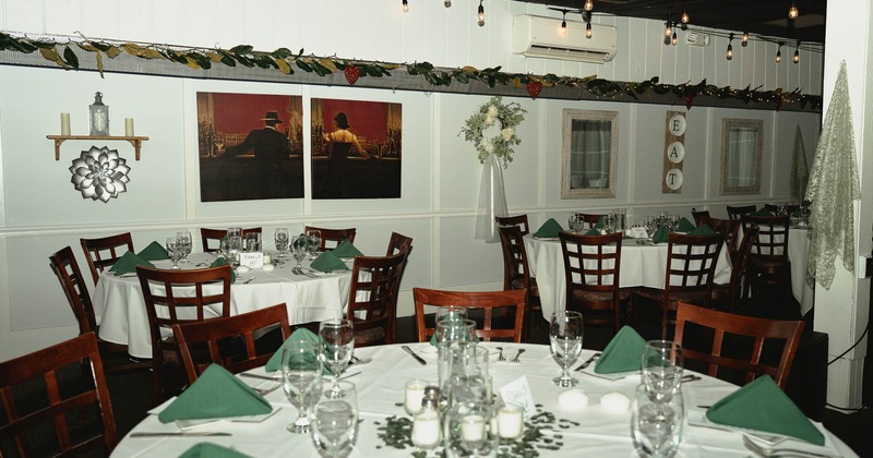 Interior, rounded tables with tableware