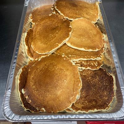Large tray of pancakes.