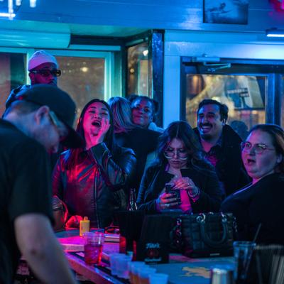 Party night, people in bar area.