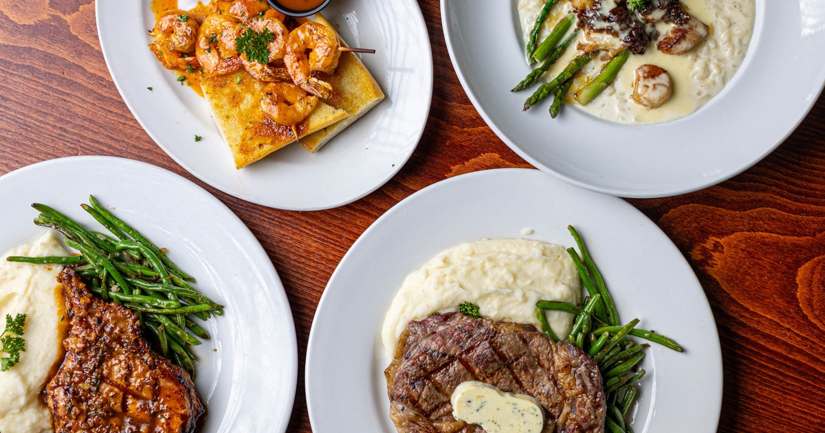 Four plated entrees including steak, shrimp, and vegetables
