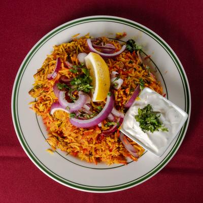 Slow cooked Basmati rice with red onion, cilantro, and creamy white sauce.