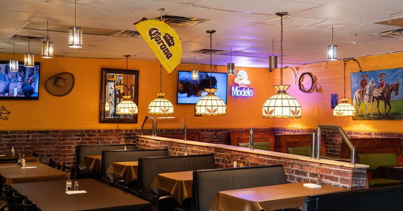 Interior seating area with double booths, chairs and tables