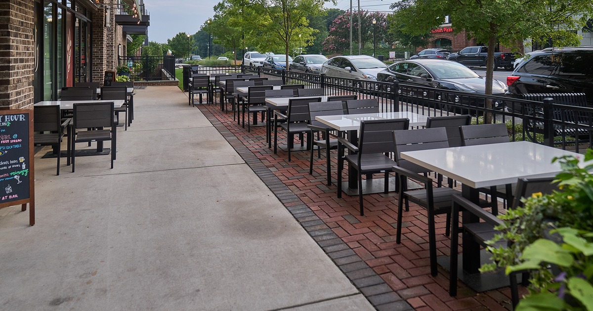 Patio, seating area with tables and chairs