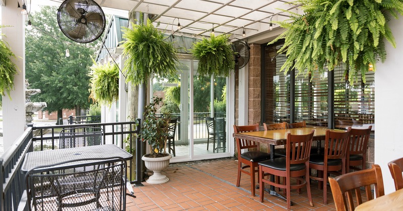 Covered patio with dining tables