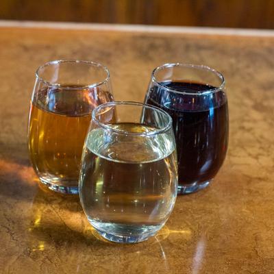 Three glasses of different wines.