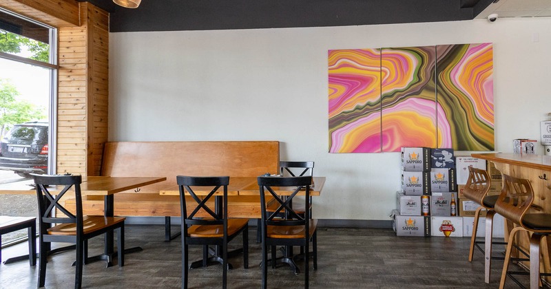 Interior, table with chairs with picture on the wall