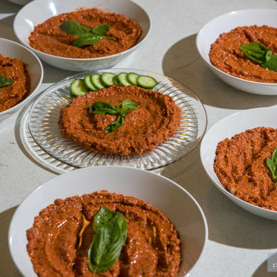 Plates of cucumber and red sauce