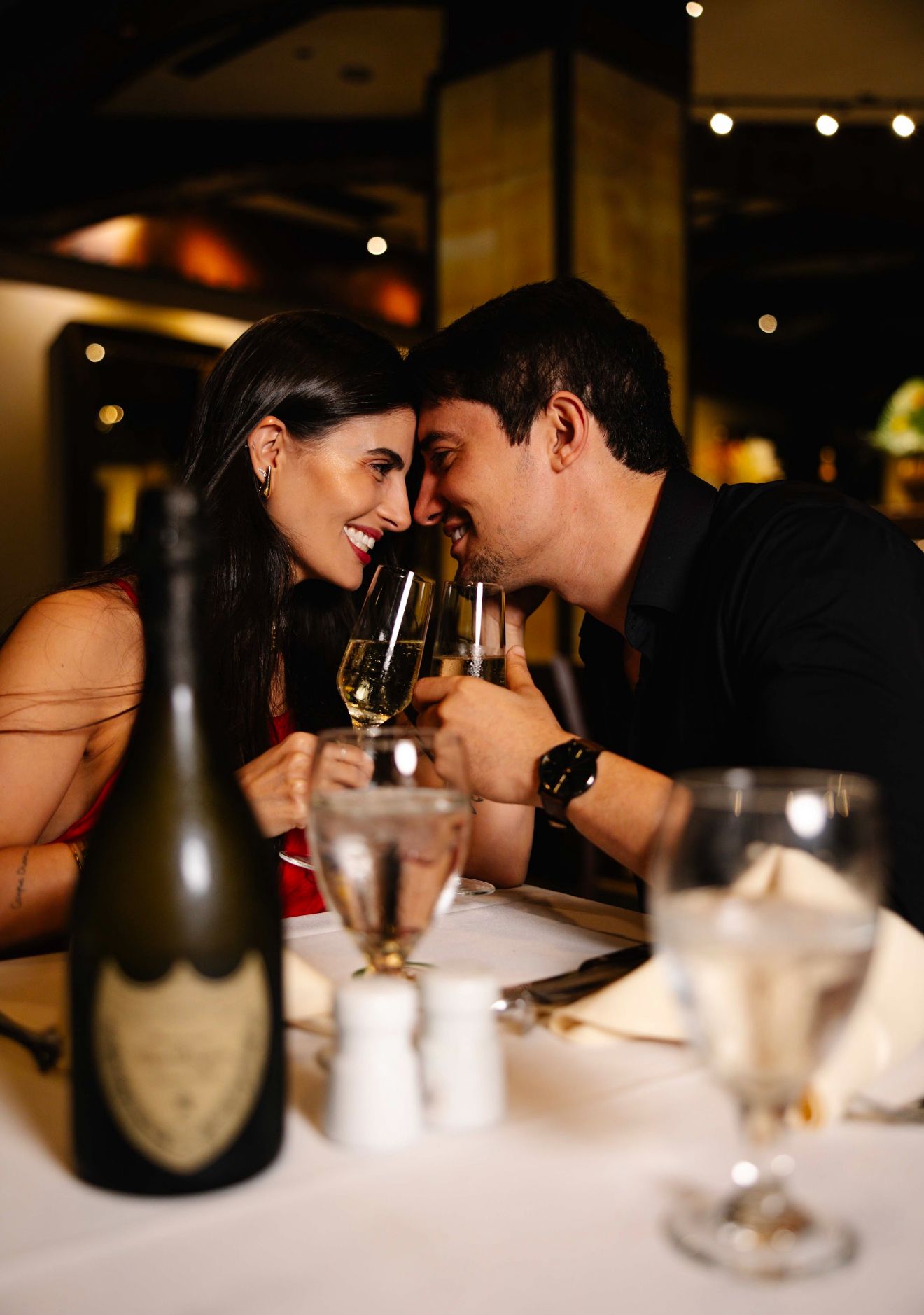 Two hands holding drinks