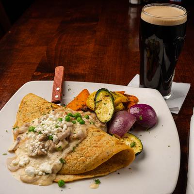 Irish Bacon Boxty in whiskey cream sauce, with vegetables on the side