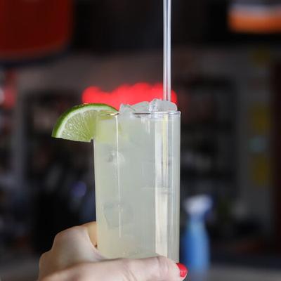 A hand holing a drink.