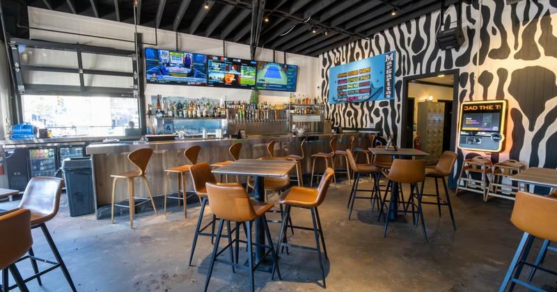 seating area with tvs on wall