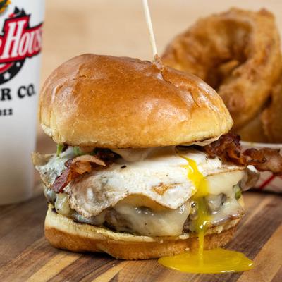 Bacon cheeseburger with fried egg, avocado, and garlic aioli.