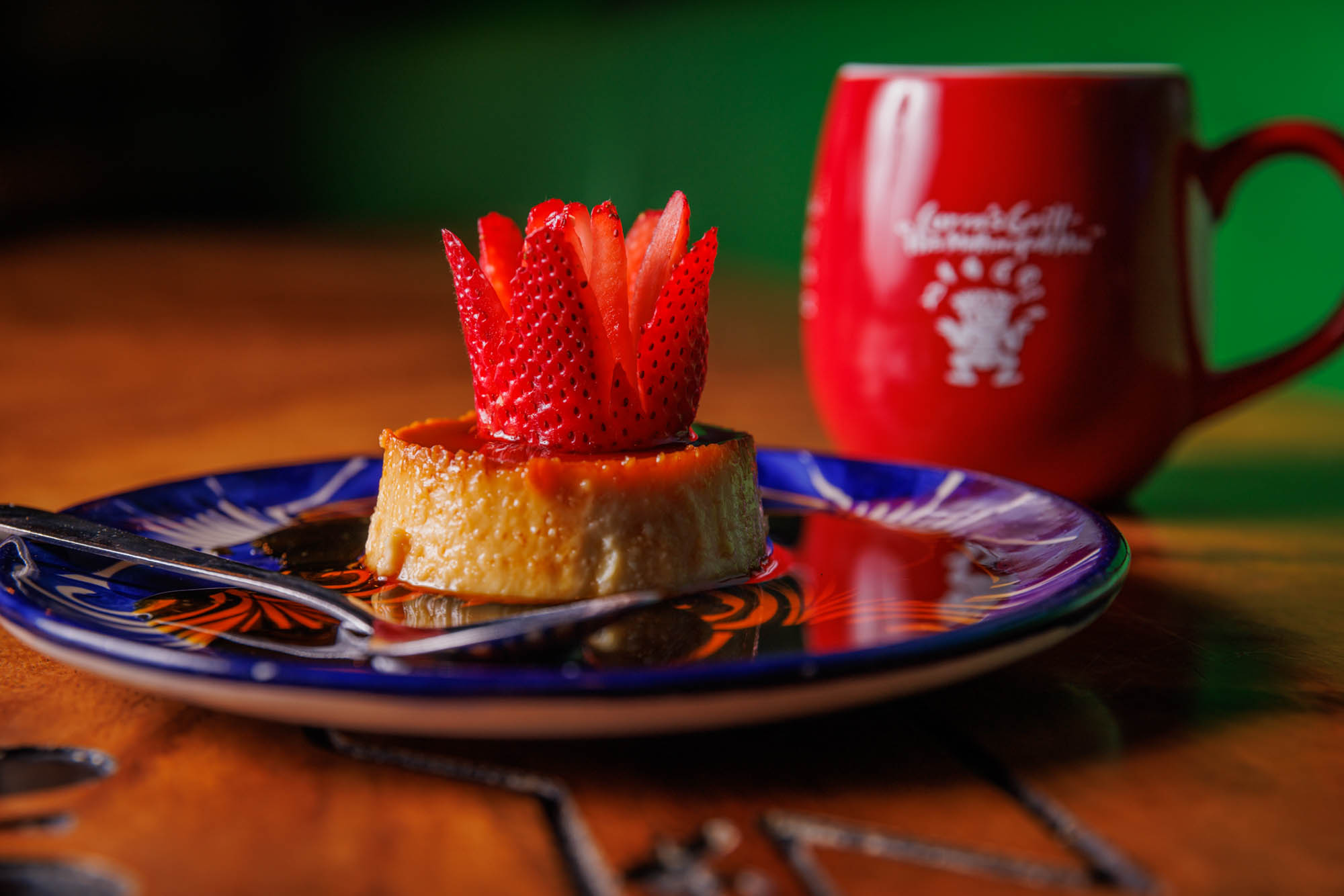 Flan topped with strawberry garnish