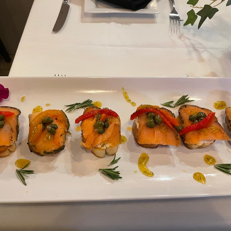 Smoke salmon Serve with creamy goat cheese, capers and honey, mustard dill dressings photo