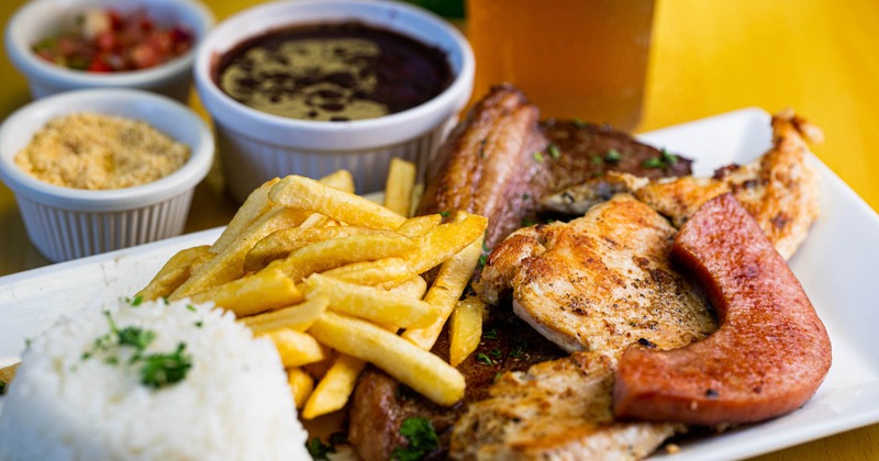 Mixed meat platter, with fries and rice
