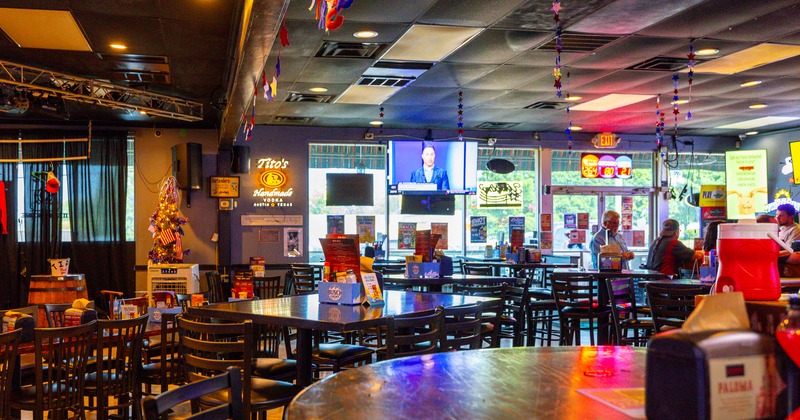 Interior, bar chairs and tables and mini stage area