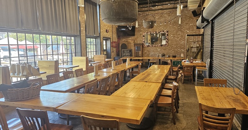 Interior, wide view, dining tables and seating, bar area