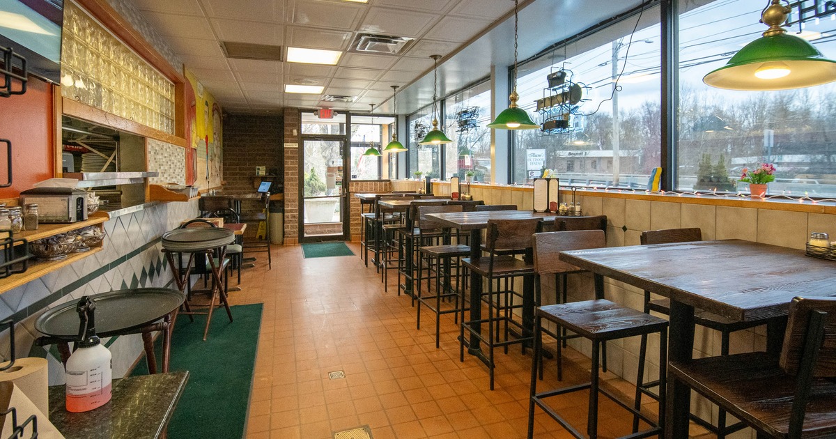 Interior, tables and chairs near window