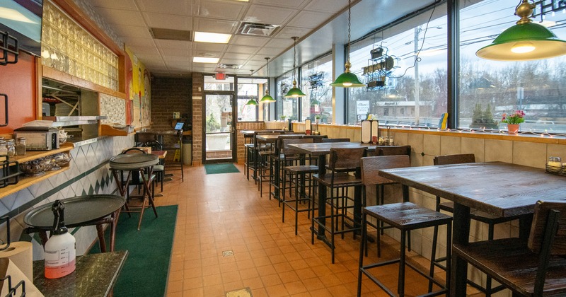 Interior, tables and chairs near window