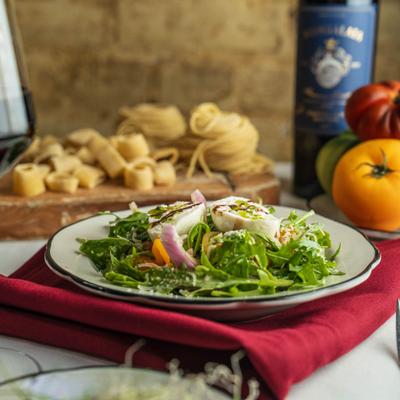 A fresh Burrata salad served.