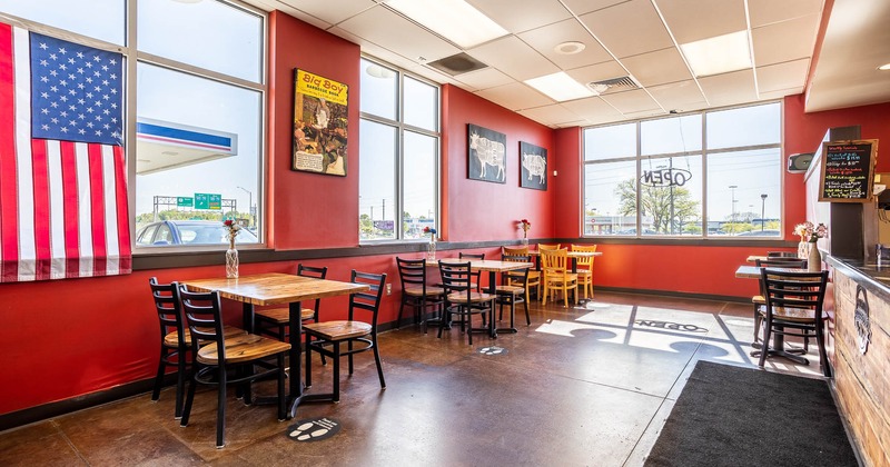 Interior, large windows, seating area and bar counter