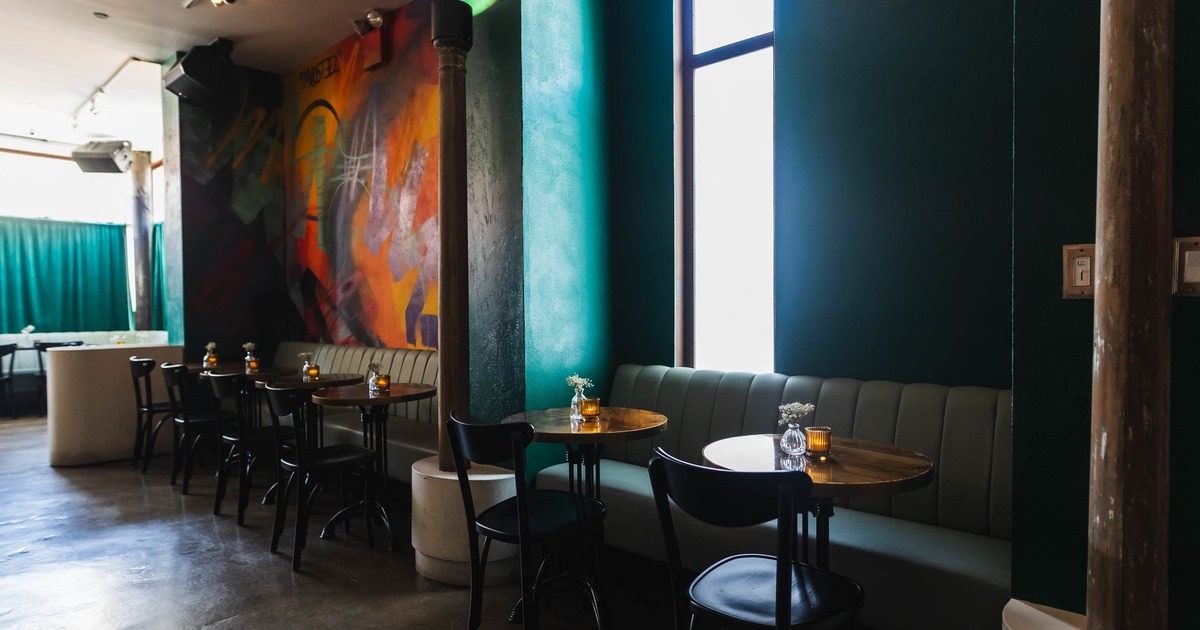 Interior, banquette seating and tables ready for guests