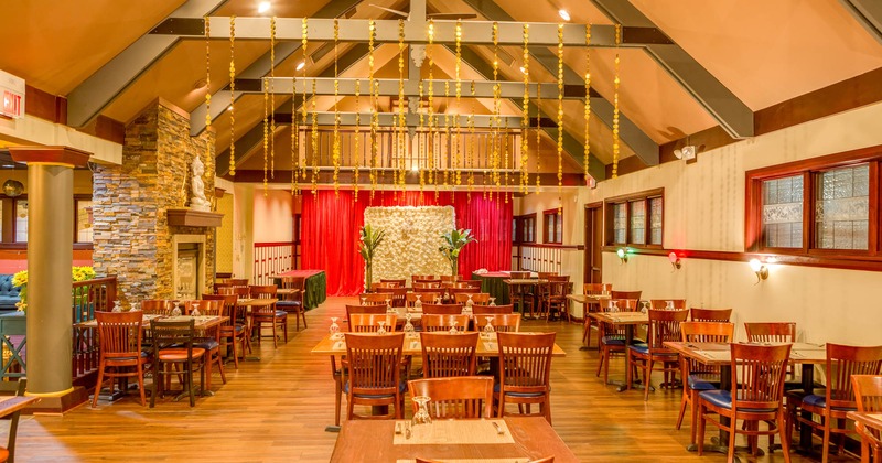 Interior, tables and chairs, wide view to the diner area