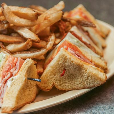 Club sandwich with fries.