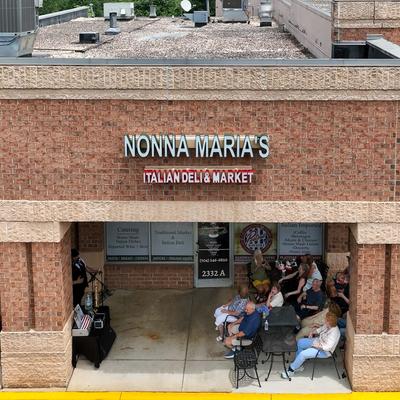 Exterior, aerial view to front of deli and market.