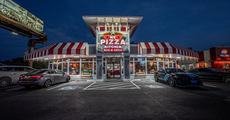 Exterior, view of the restaurant and parking lot, nighttime