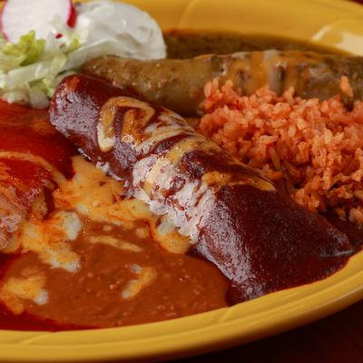 Grilled sausage, rice and dips on the side