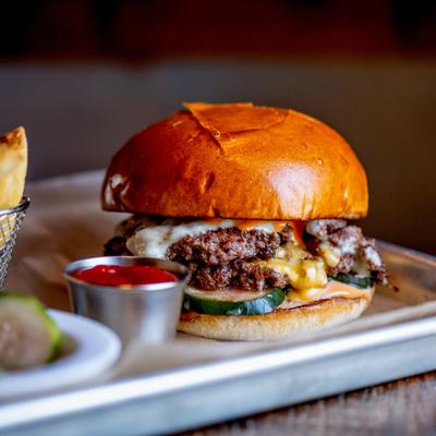 Smash burger with sides, close up.