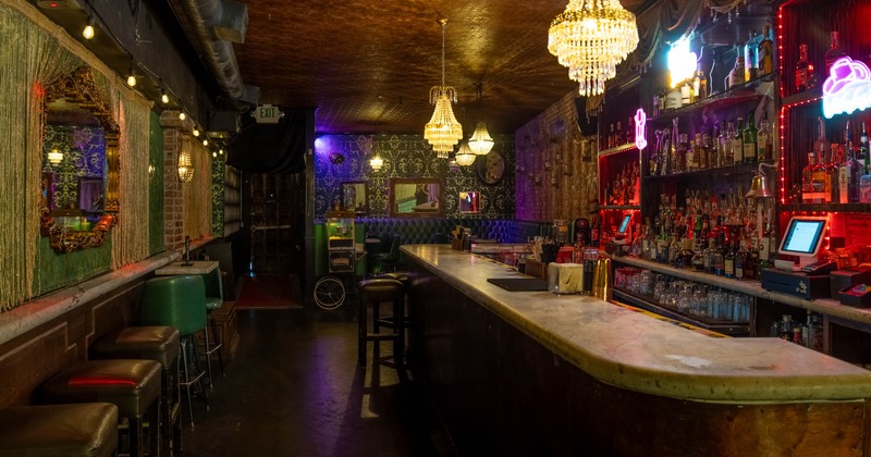 Interior, bar area, marble top bar with bar stools, various decoration, vintage wallpaper