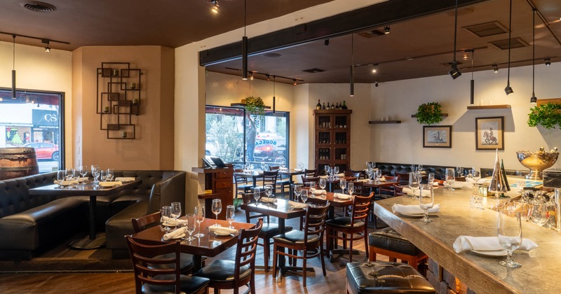 Interior, dining area, tables and chairs ready for guests, seating booth, shop window