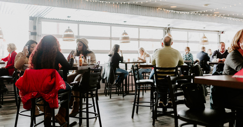 Interior with guests sitting at tables