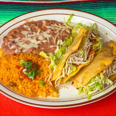 Tacos with Mexican rice and refried beans.