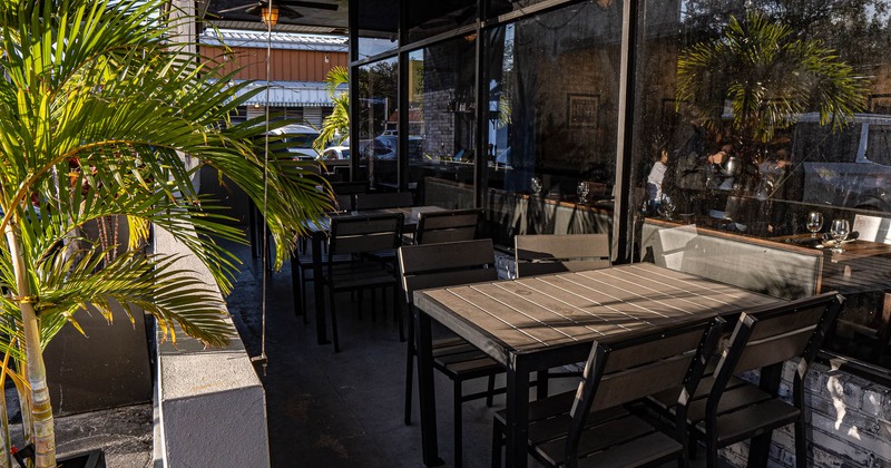 Patio, seating area with tables and chairs