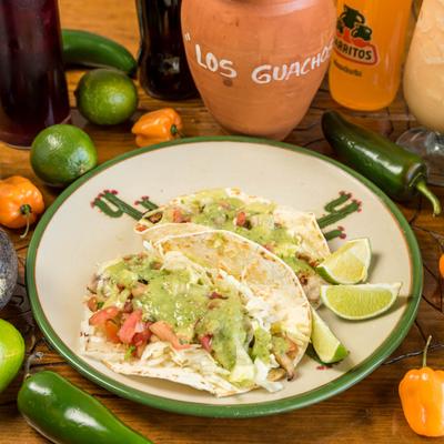 Grilled fish taco, with lettuce, pico de gallo and avocado salsa