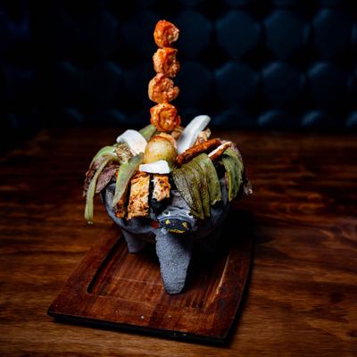 Chicken, shrimp, and steak Molcajete.