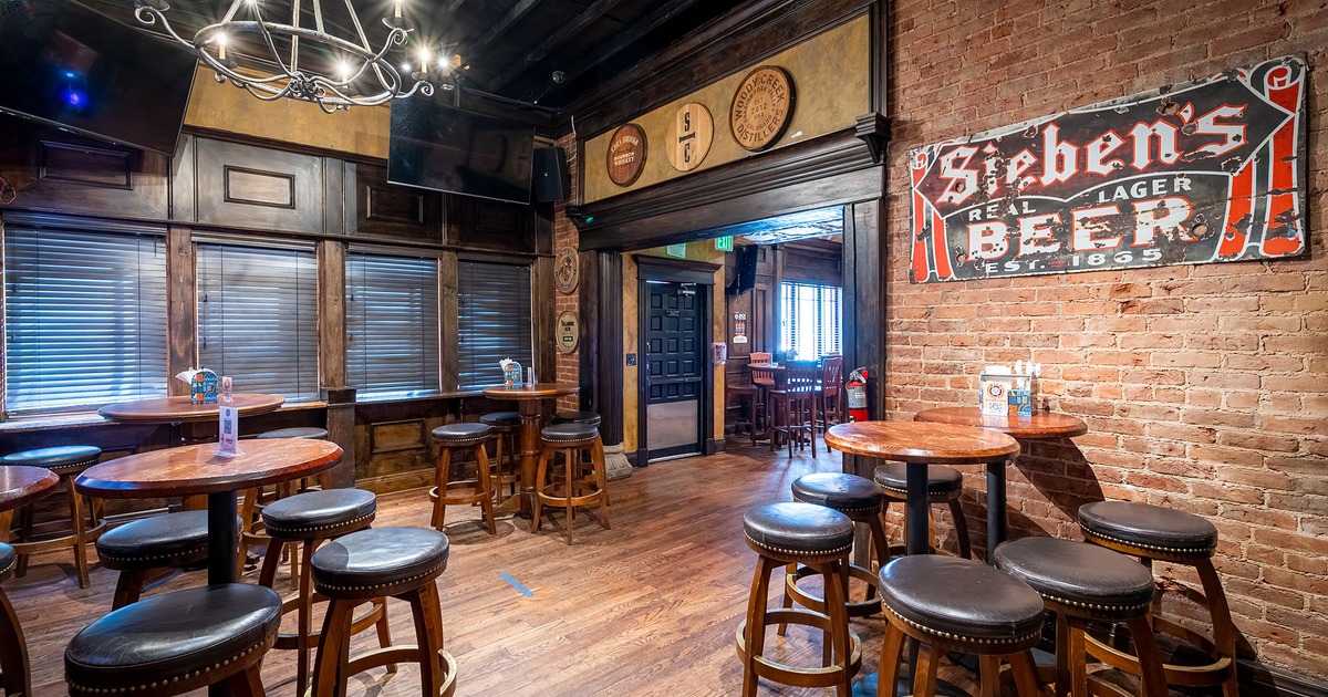 Interior, seating area with high tables and stools