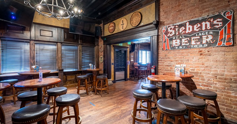 Interior, seating area with high tables and stools