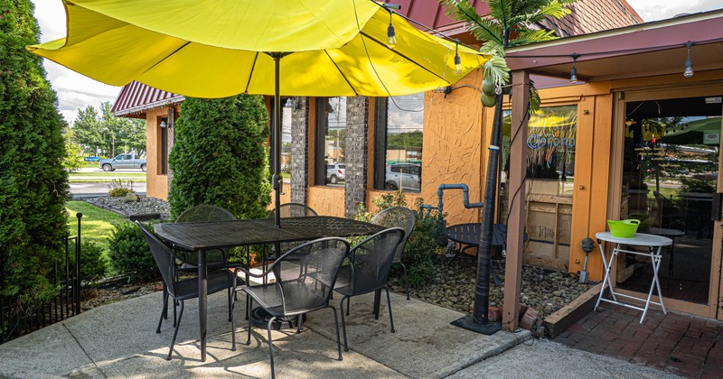 Exterior, patio, table, chairs, parasols