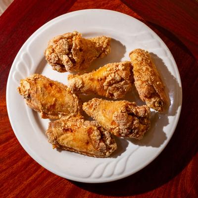 Fried Chicken Wing plate on a table, top down view.
