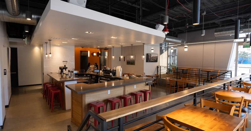 Interior, wide view, baar, tables, bar stools