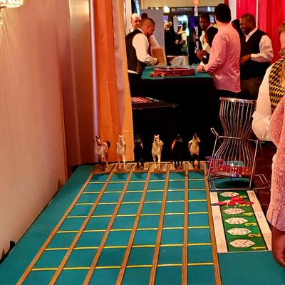 Casino-themed event with tabletop horse racing game.